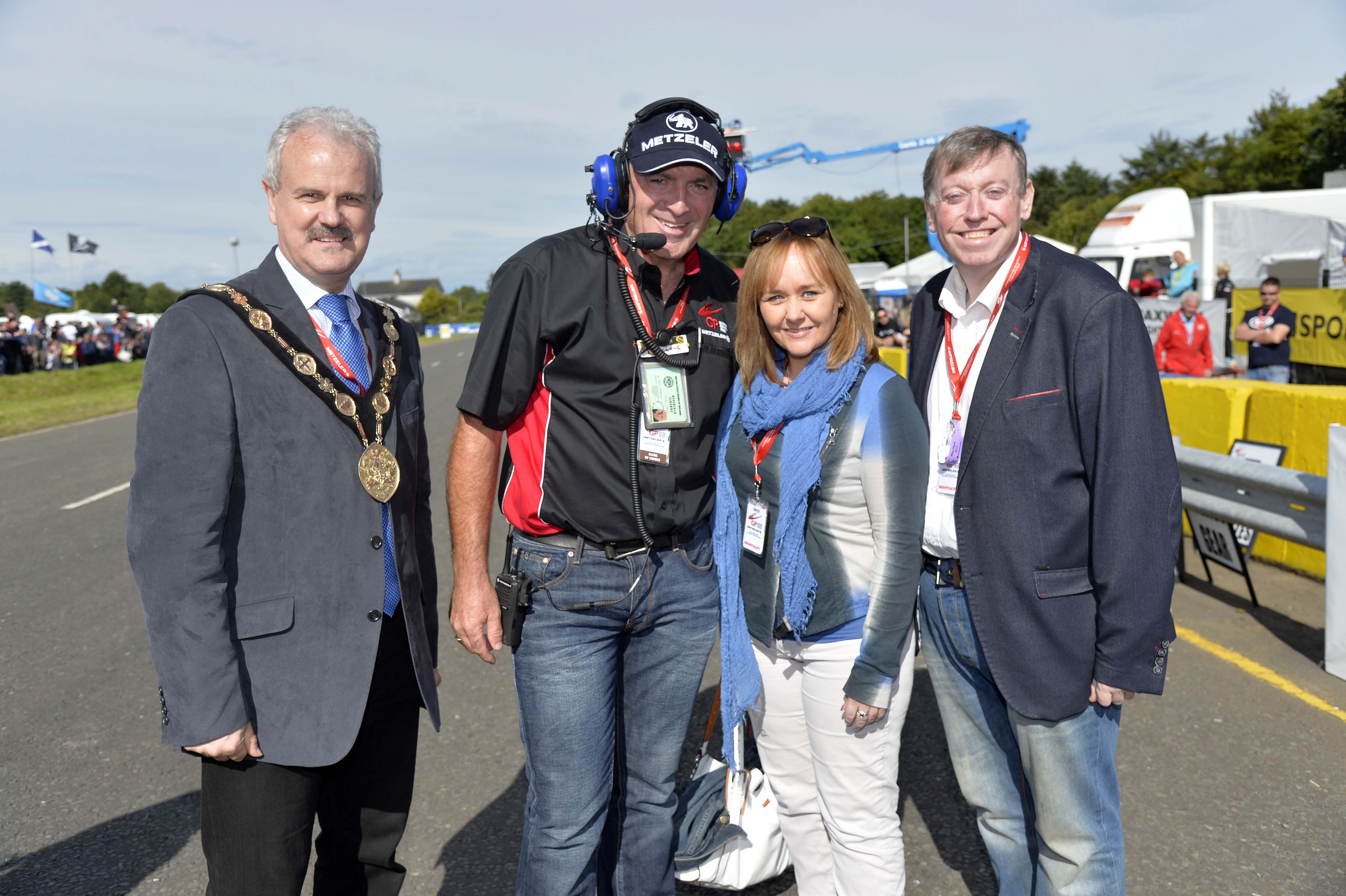 The Mayor of Lisburn & Castlereagh City Council, Councillor Thomas Beckett, Chairman of the Leisure and Community Development Committee, Alderman Paul Porter and  Junior Minister at the Office of the First Minister and Deputy First Minister, Michelle McIlveen chat on the grid to the Clerk of Course, Noel Johnston.