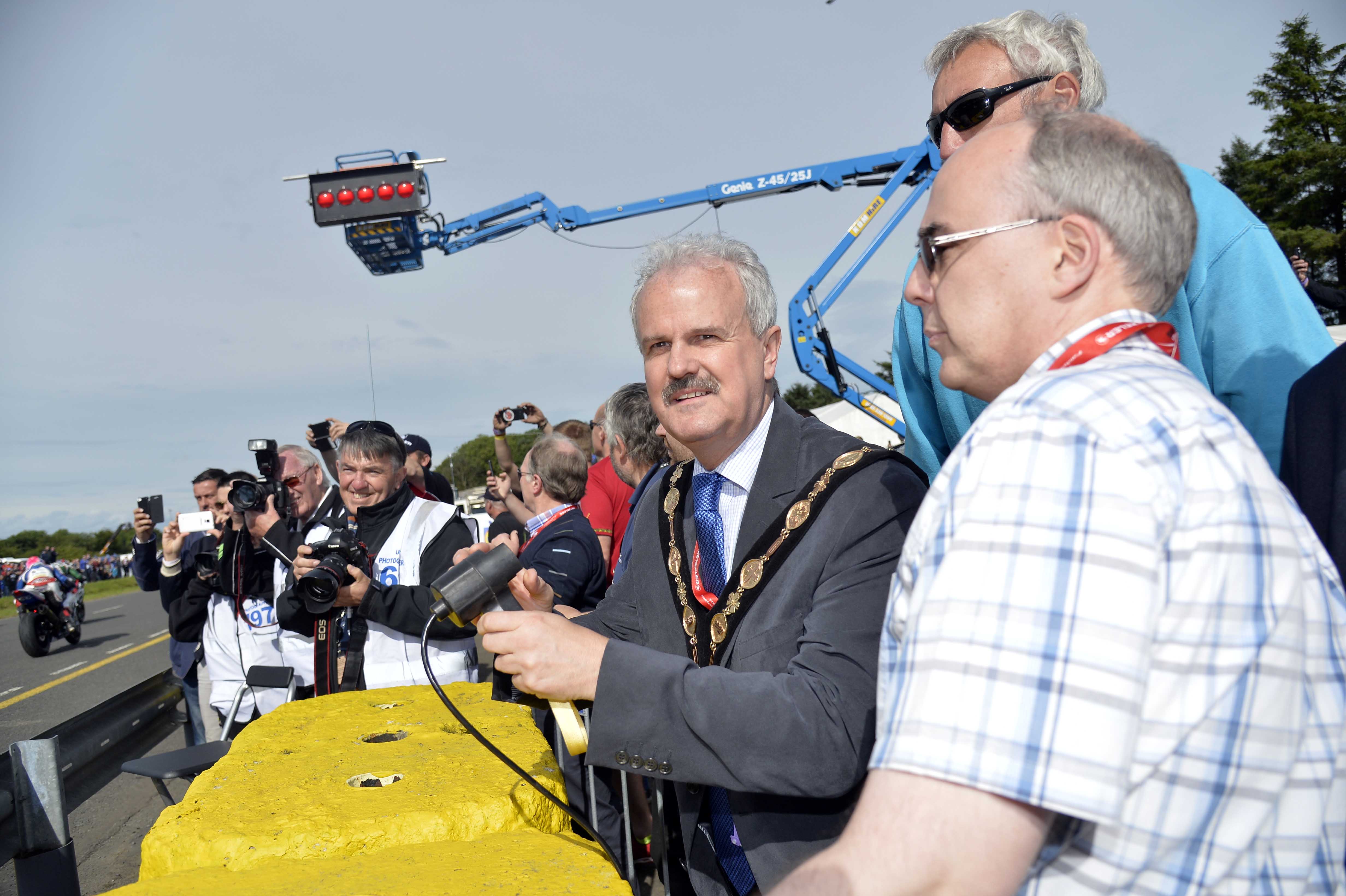 The Mayor of Lisburn & Castlereagh City Council, Councillor Thomas Beckett starts the first wave of the Superstock race which was the first race of the day.