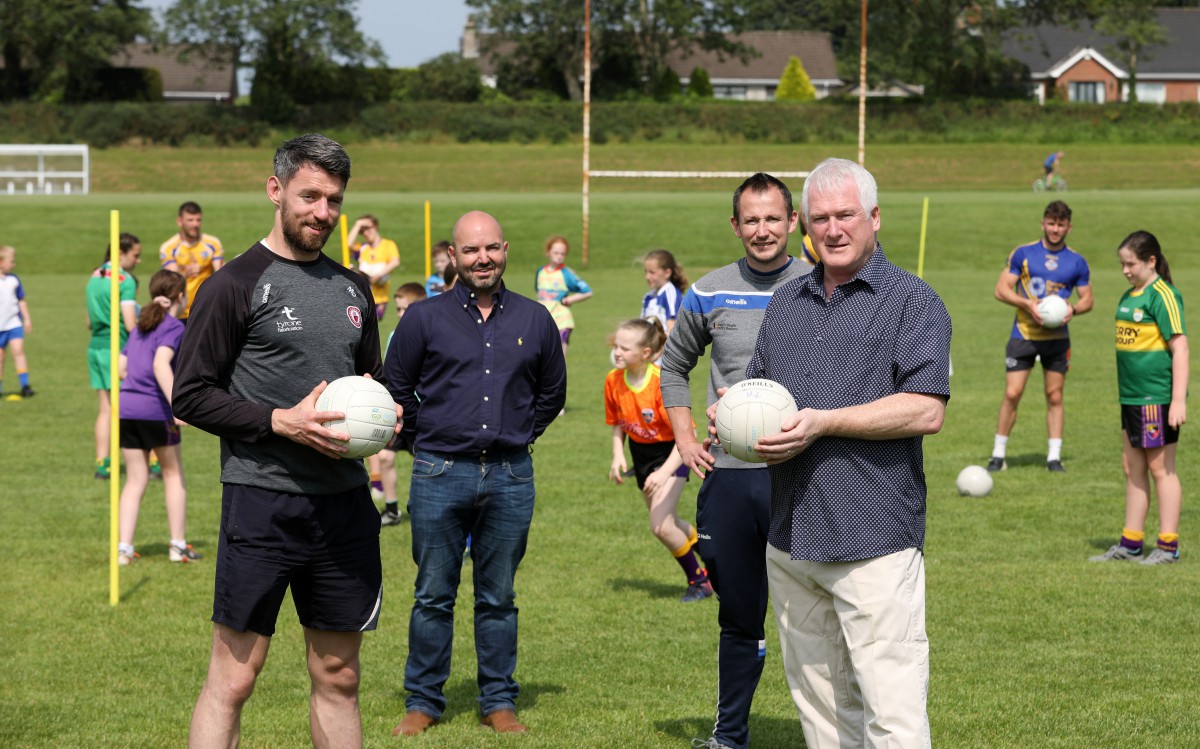 Chairman of the Lisburn & Castlereagh City Council’s Leisure and Community Development Committee, Alderman Michael Henderson MBE and Vice Chairman, Councillor David Honeyford is pictured at the recent GAA Summer camp at Lough Moss Leisure Centre, Carryduff with the current Tyrone Captain and 2 time All-Star, Mattie Donnelly and Sports Development Officer, Kevin Madden.